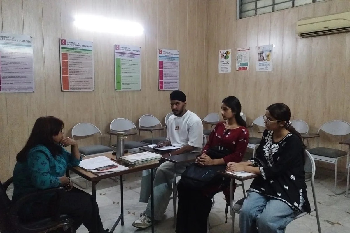 A facilitator leading a small-group learning session at Rosemounts Institute