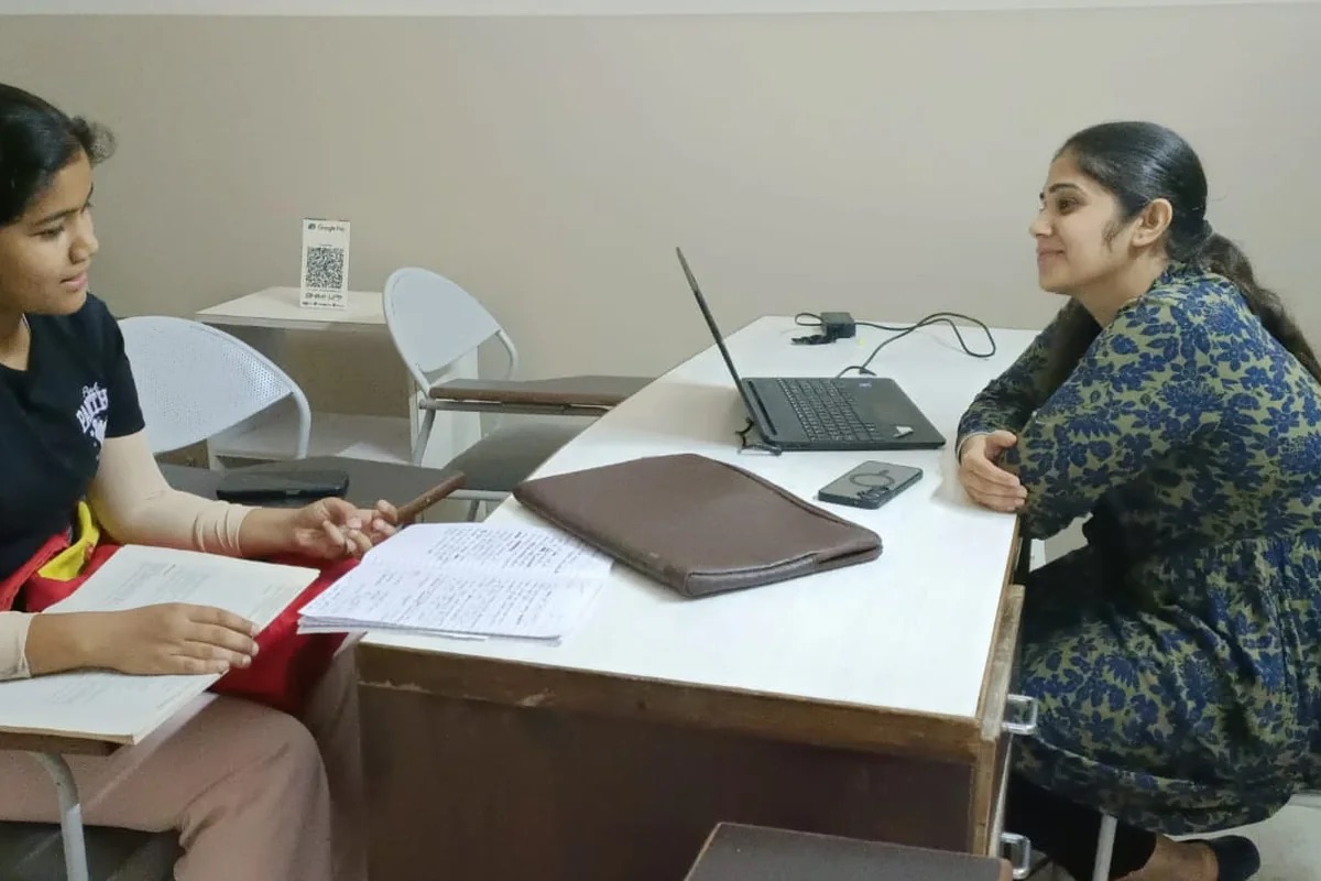 A student receiving individual guidance at Rosemounts Institute in Dehradun