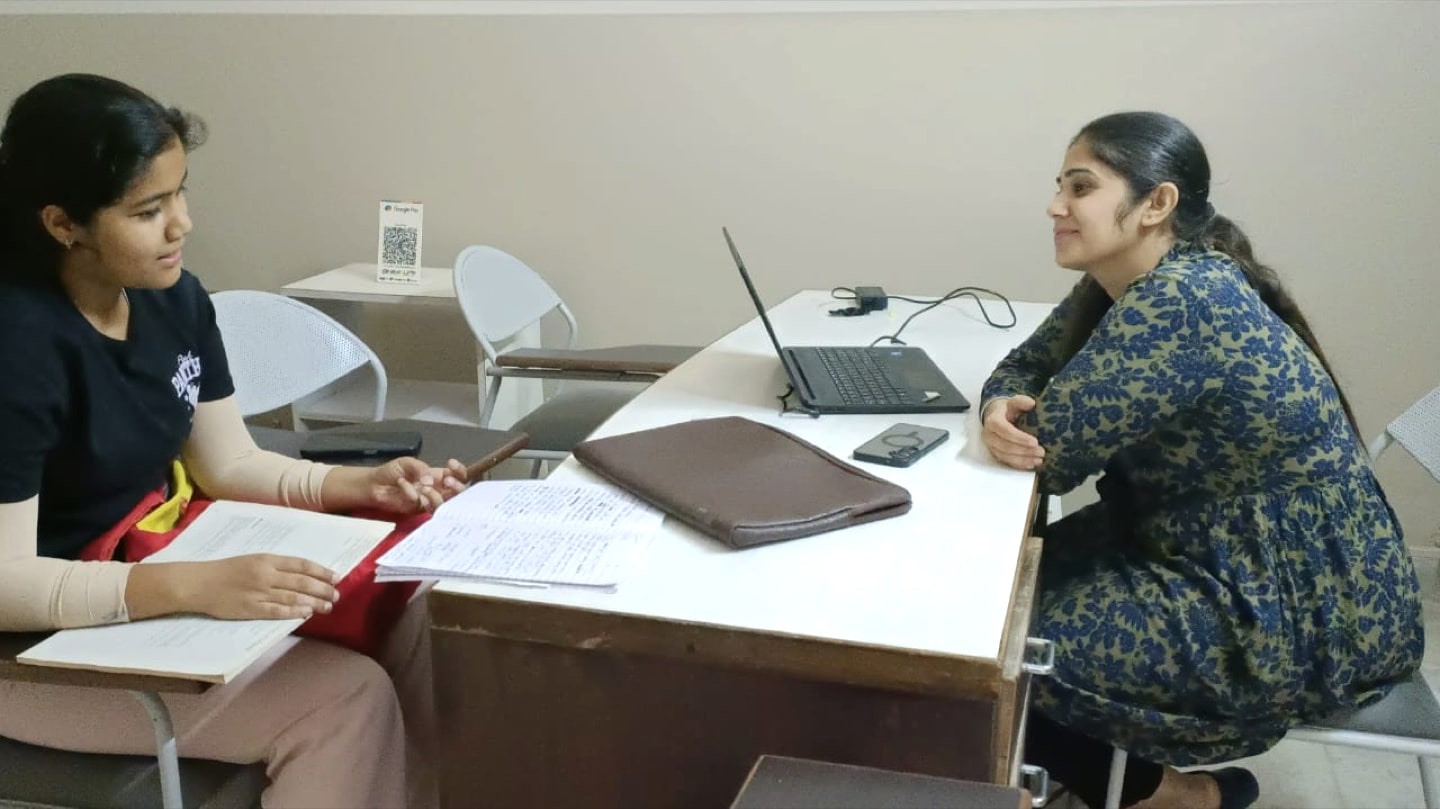 An IELTS learner receiving individual feedback from a Rosemounts teacher in Dehradun